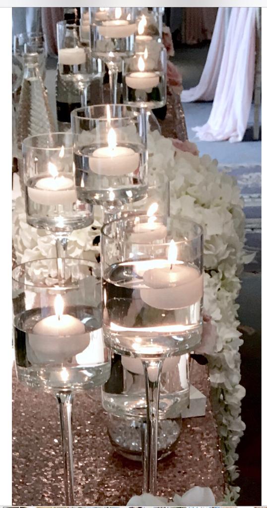 Floating glass candle holders