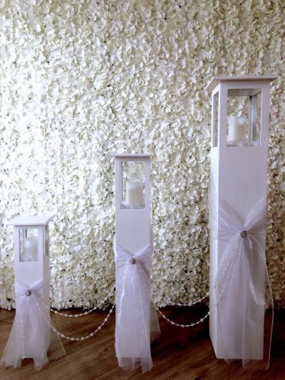 Tall set of 3 tall candle lanterns.