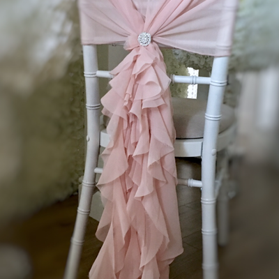 Blush pink chair hoods and ruffles