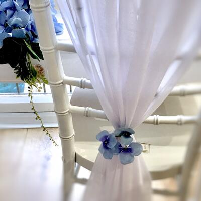 White chiffon chair drapes